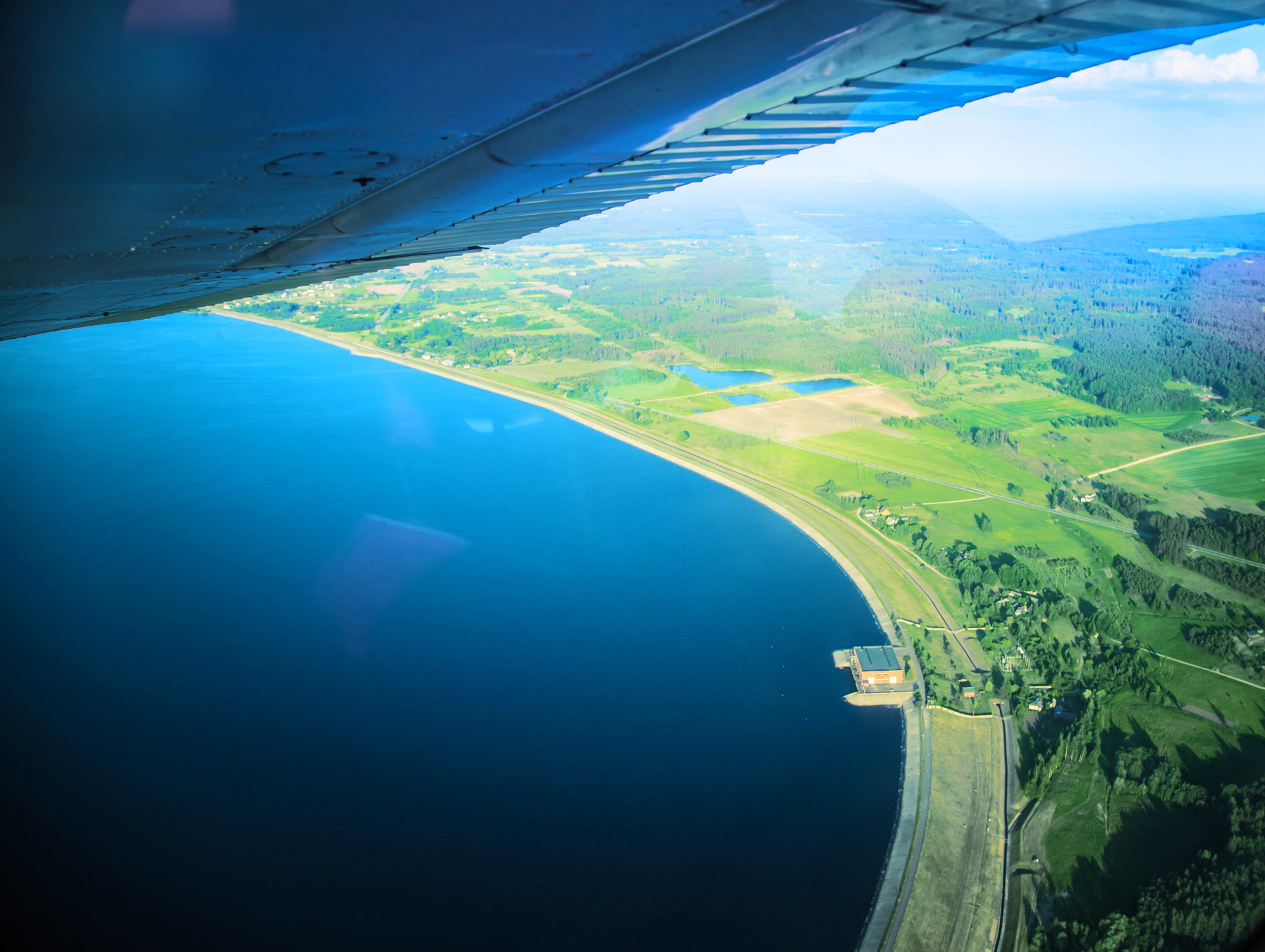 airplane over water from below website