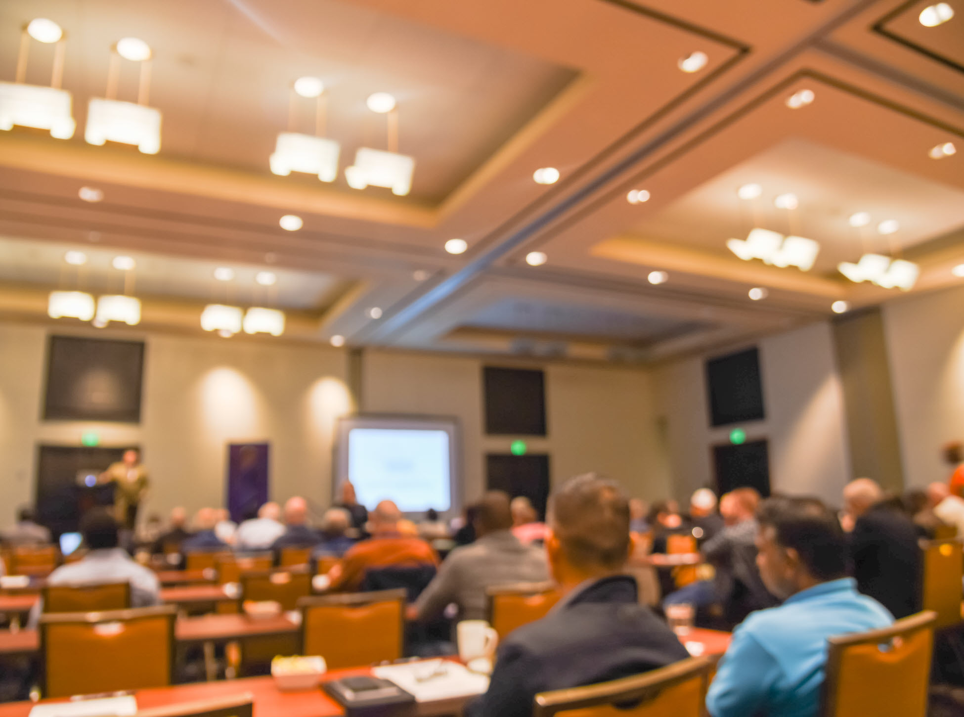 blurred image of meeting in ballroom