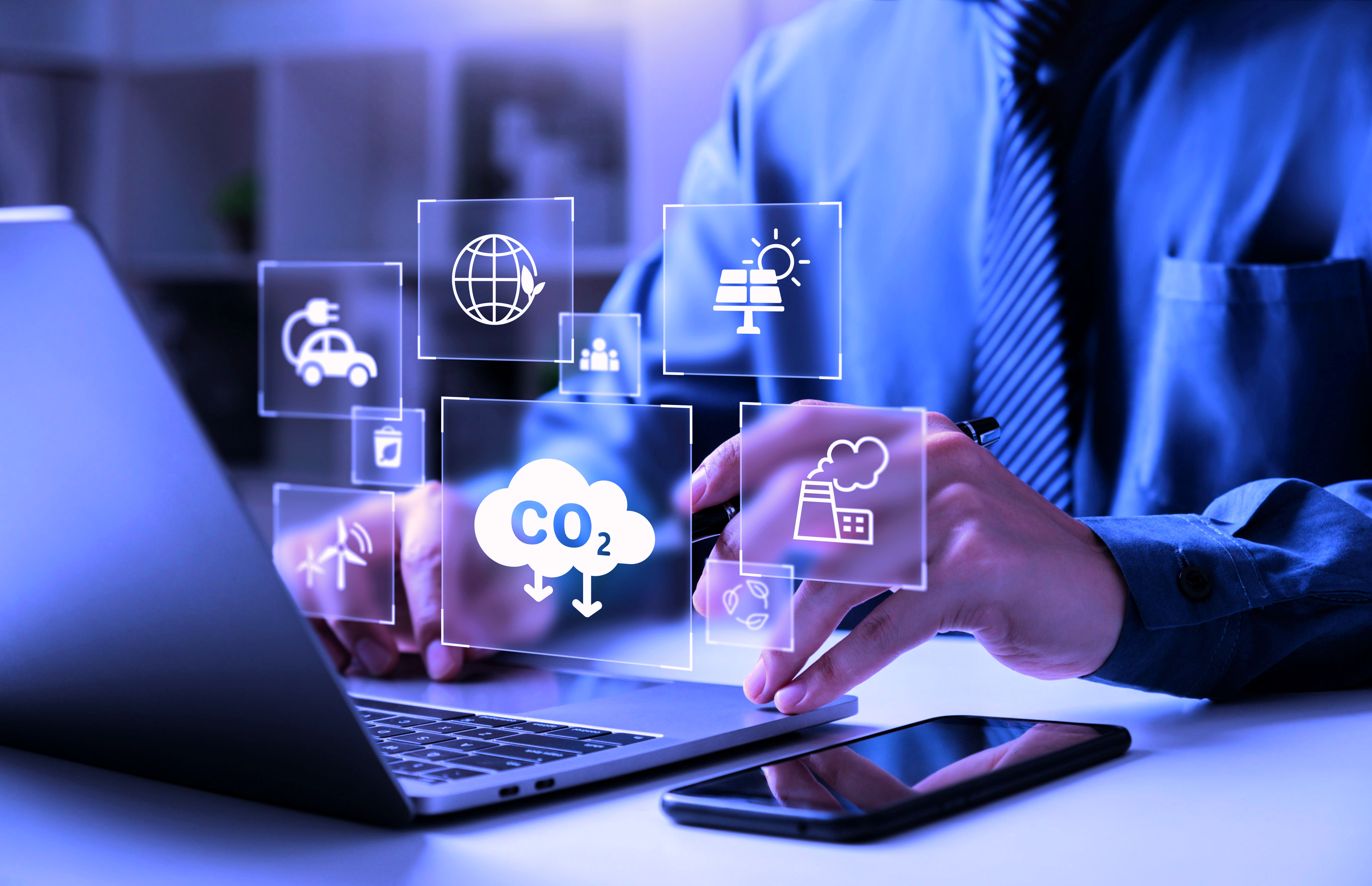 business man at laptop co2 reduction analysis