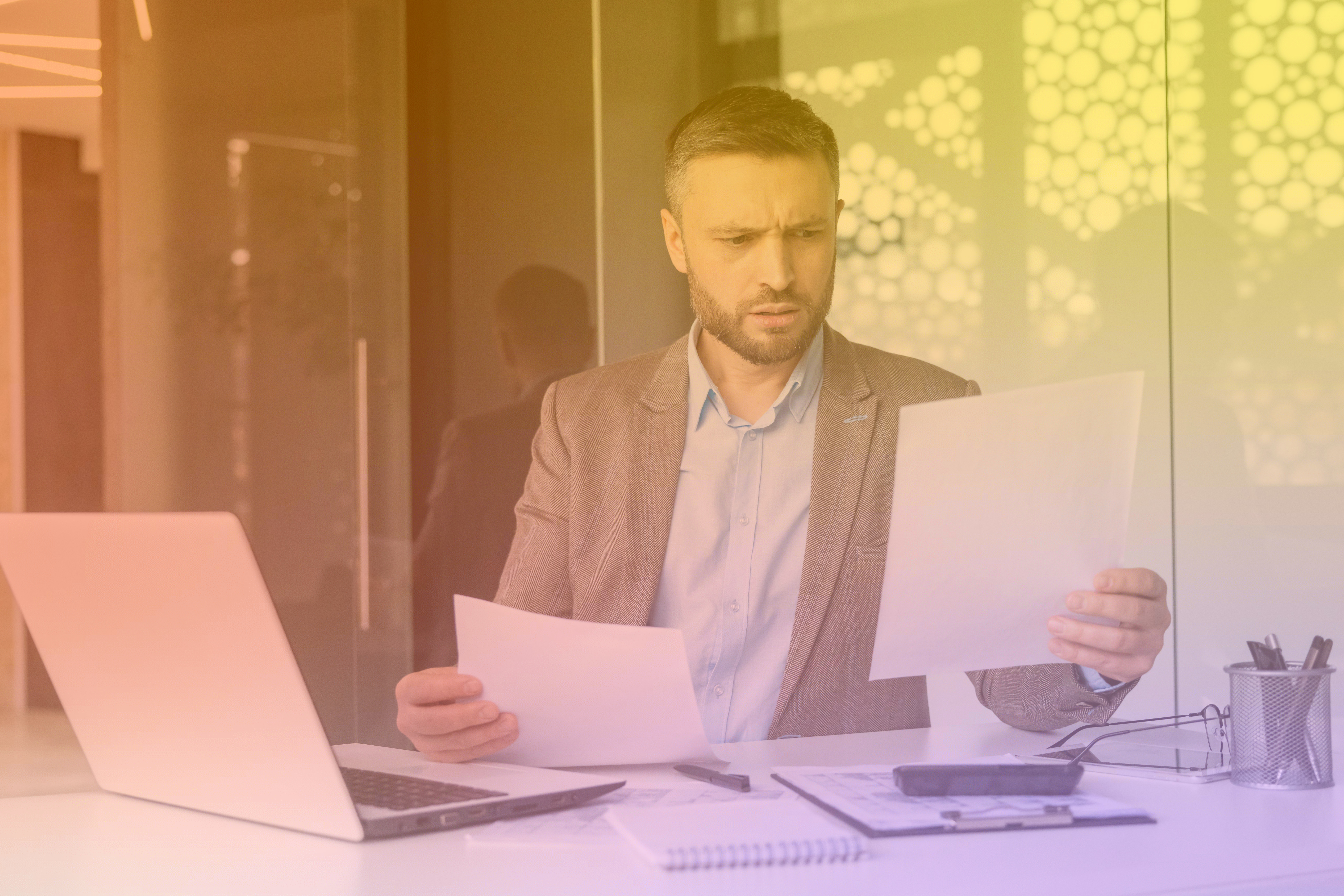 business man confused reading documents