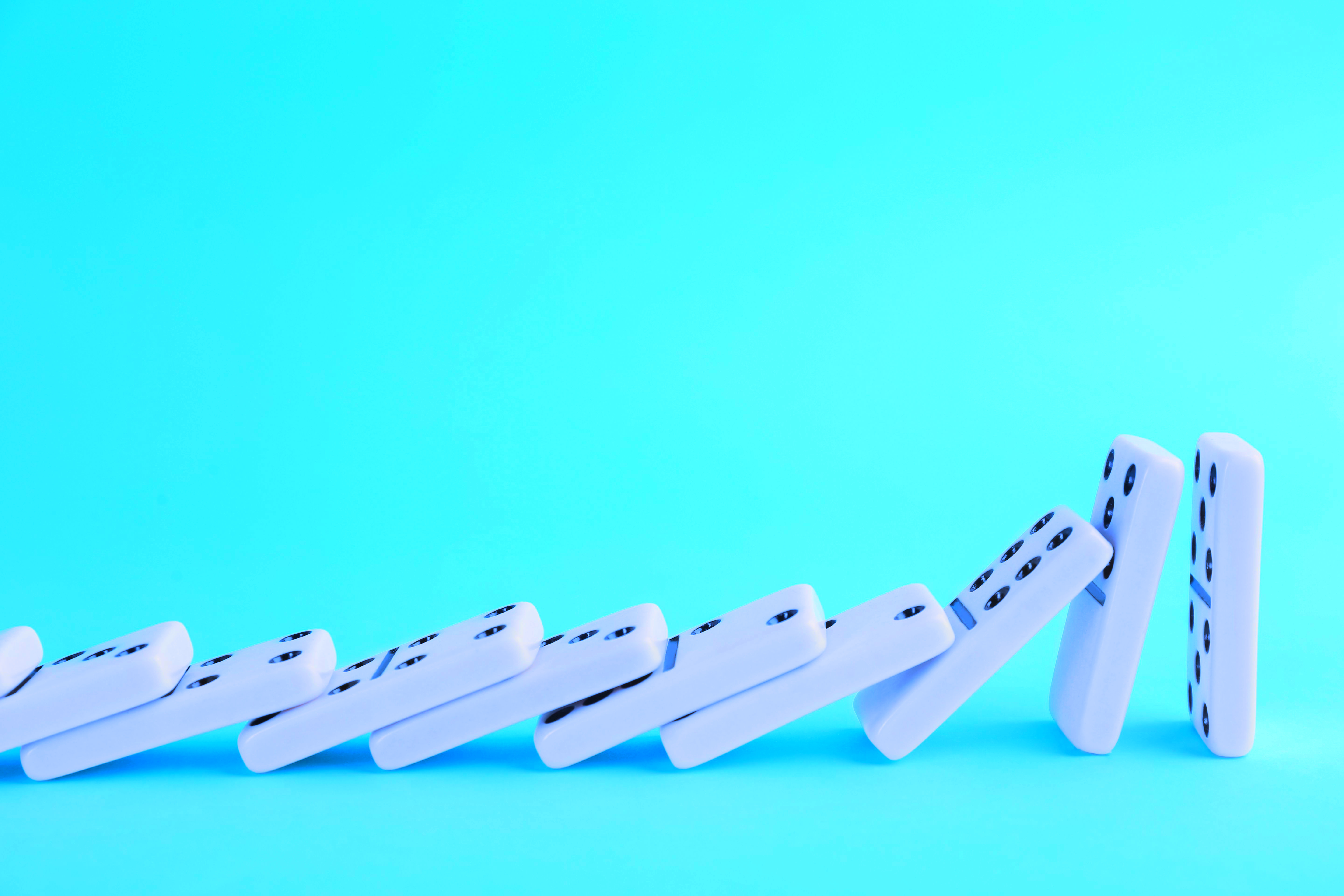 dominoes falling website