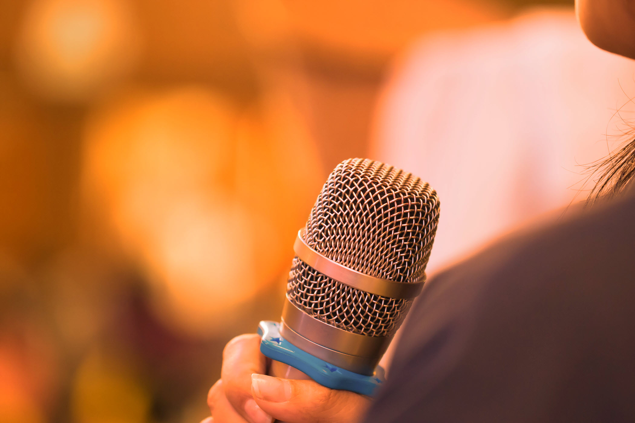 microphone orange background website-1