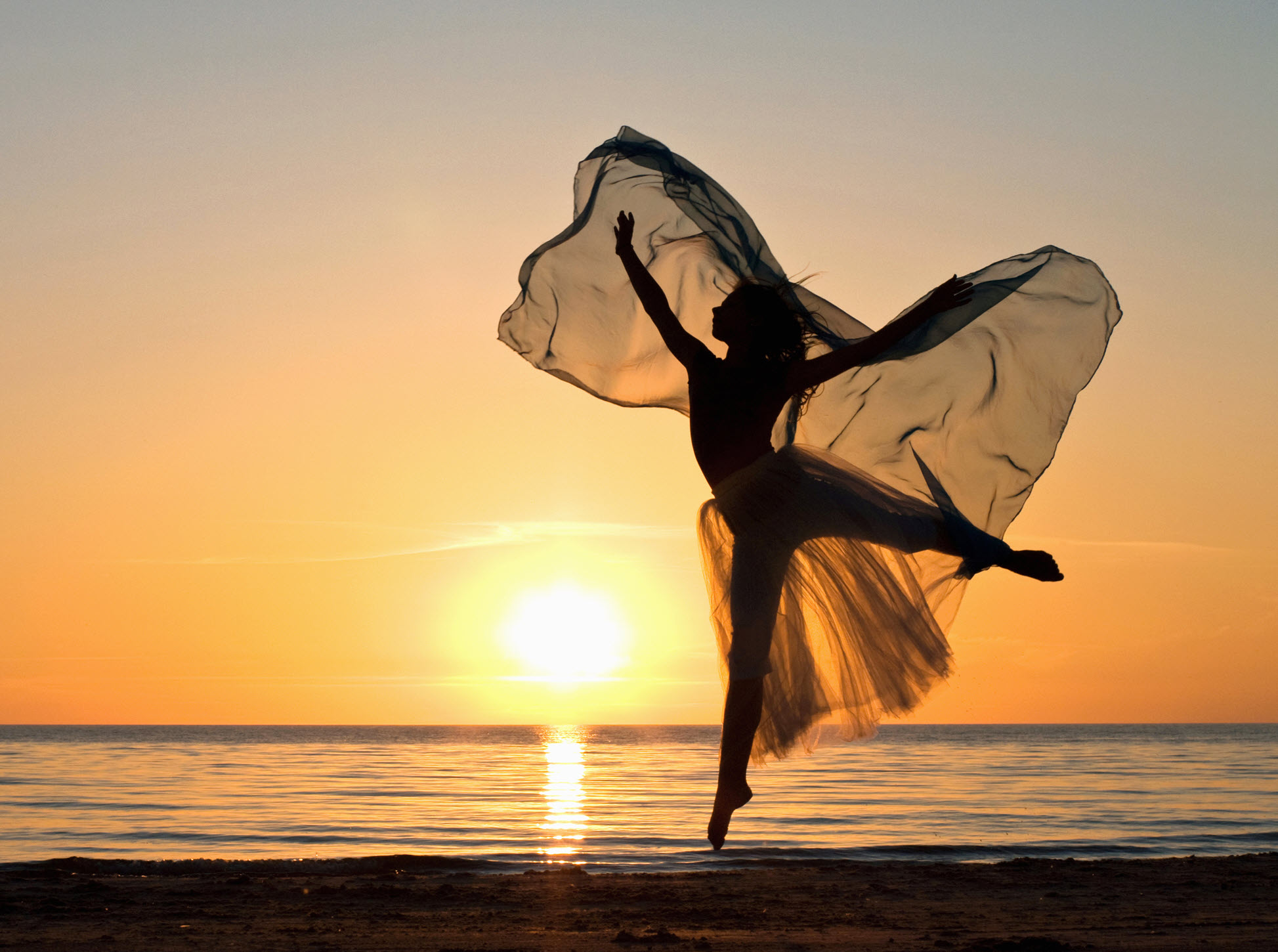 woman on beach butterfly sunset website